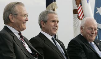 **FILE** President Bush (center), Vice President Dick Cheney (right) and outgoing Defense Secretary Donald H. Rumsfeld take part in an Armed Forces Full Honor Review for Rumsfeld on Dec. 15, 2006 at the Pentagon. (Associated Press)