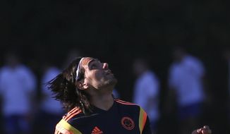 Colombia&#39;s player Radamel Falcao trains in Buenos Aires, Argentina, Wednesday, May 28, 2014. Colombia&#39;s national soccer team is hoping Falcao will be able to play at the World Cup after his knee injury. Brazil is hosting the international soccer tournament starting in June. (AP Photo/Sergio Llamera)
