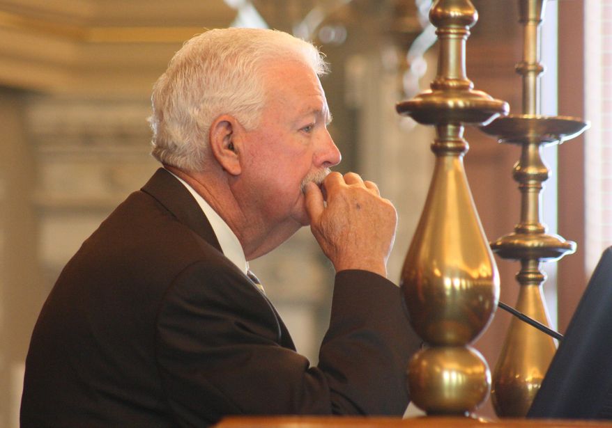 Kansas House Speaker Ray Merrick, a Stilwell Republican, presides over the chamber during its formal, annual adjournment ceremony, Friday, May 30, 2014, at the Statehouse in Topeka, Kan. Merrick says he expects the state to bounce back from recent monthly revenue shortfalls. (AP Photo/John Milburn)