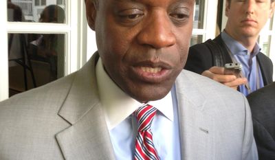 Detroit emergency manager Kevyn Orr speaks with reporters after addressing the Mackinac Policy Conference on Friday, May 30, 2014 on Mackinac Island, Mich. Orr said city retirees and workers considering a deal to cut their pensions risk much steeper reductions if they make a &amp;quot;protest vote&amp;quot; over a restructuring plan to help Detroit out of bankruptcy. (AP Photo/David Eggert)