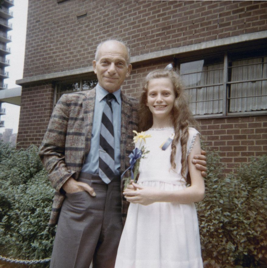 In this June 1971 photo provided by Beth J. Harpaz, Beth is shown as a child after her graduation from elementary school in New York, with her father, David Jackendoff. Jackendoff parachuted into Normandy with the 101st Airborne on D-Day, June 6, 1944. Though he died in 1993, wartime radio interviews with him and a TV interview on the 40th anniversary of D-Day preserved his stories. (AP Photo/Courtesy of Beth J. Harpaz)