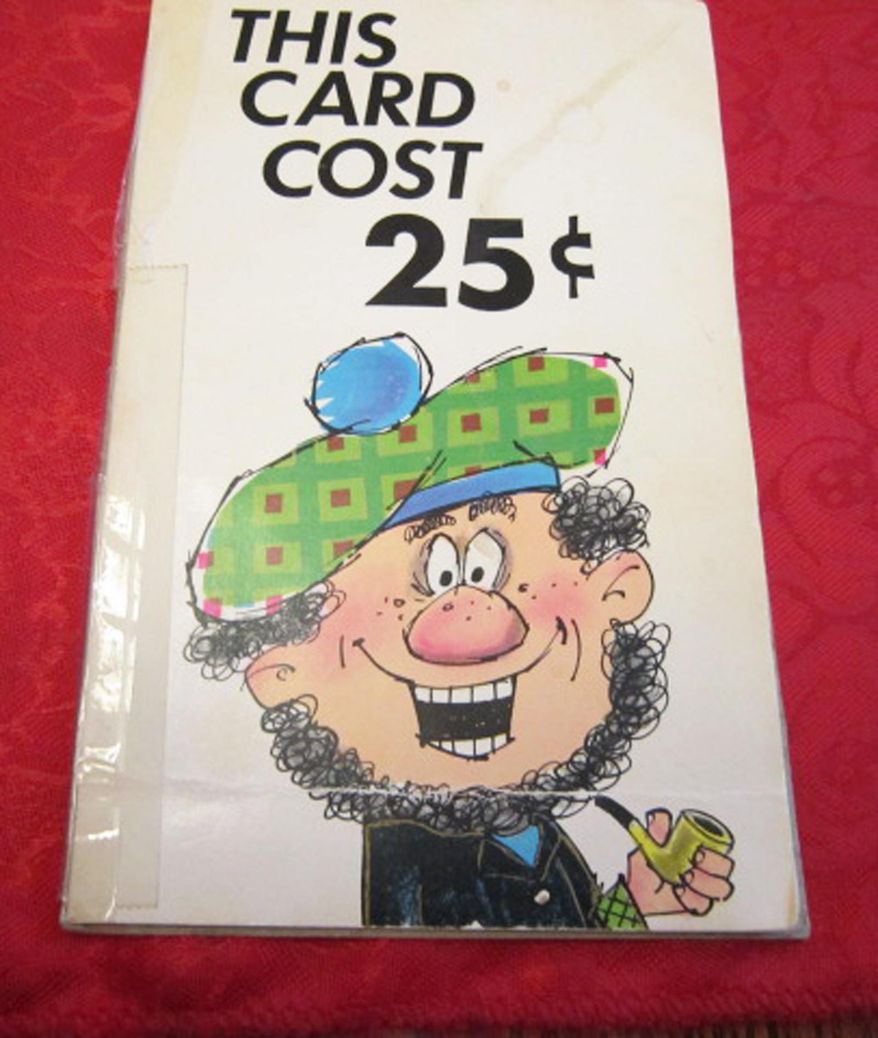 ADVANCE FOR USE SATURDAY, MAY 31 - This photo taken on May 19, 2014, shows the 25-cent birthday card that Dean Baugh and Bob Thornburg, both of Fremont, Neb., have exchanged for 37 years. (AP Photo/The Tribune, Betsy Hansen)