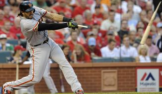 San Francisco Giants&#39; Michael Morse follows through on a broken-bat single against the St. Louis Cardinals in the first inning in a baseball game on Friday, May 30, 2014, at Busch Stadium in St. Louis. (AP Photo/Bill Boyce)
