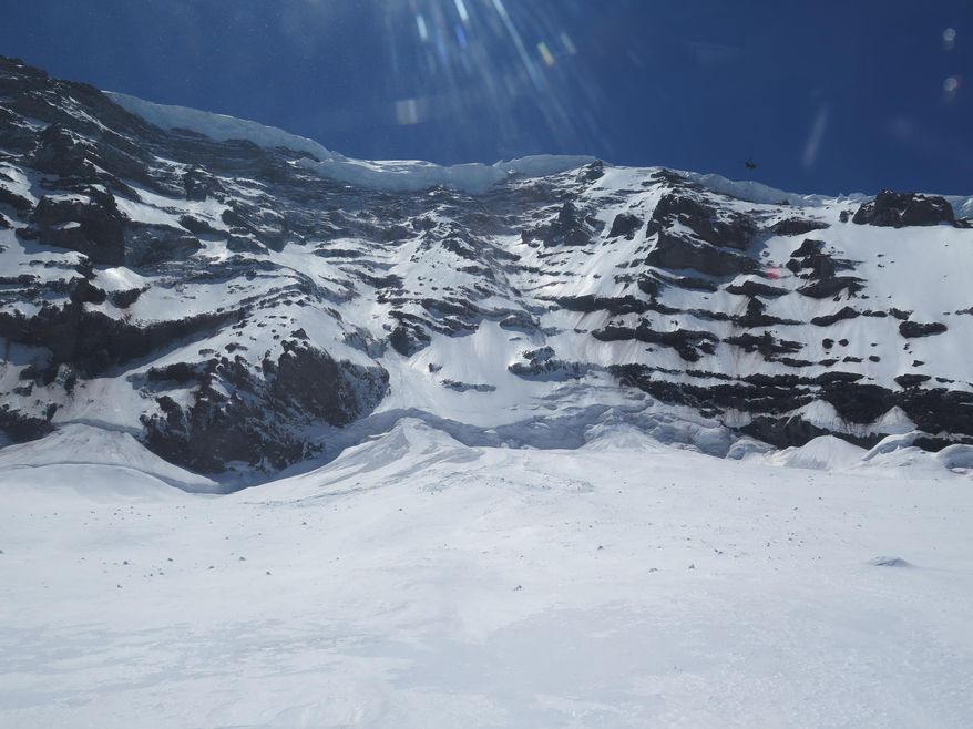 This photo provided by the National Parks Service, shows the Liberty Ridge Area of Mount Rainier as viewed from the Carbon Glacier, Saturday, May 31, 2014, in Washington state. Six climbers missing on Mount Rainier are presumed dead after helicopters detected pings from emergency beacons buried in the snow thousands of feet below their last known location, a national park official said Saturday. (AP Photo/National Park Service)