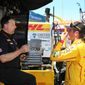 Michael Andretti, left, talks with driver Ryan Hunter-Reay after a practice session for the IndyCar Detroit Grand Prix auto race on Belle Isle in Detroit, Friday, May 30, 2014 in Detroit, Friday, May 30, 2014. (AP Photo/Bob Brodbeck)