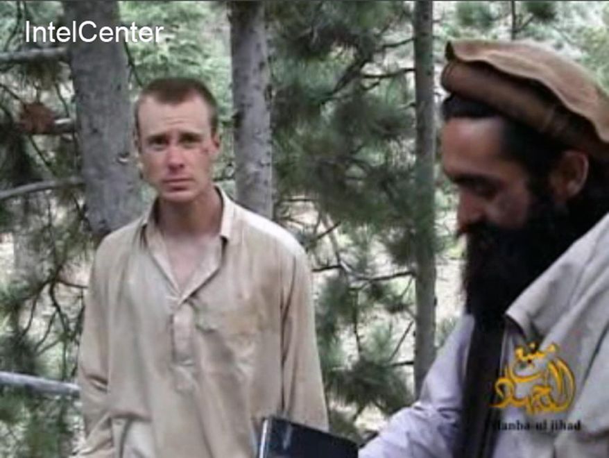 FILE - This file image provided by IntelCenter on Dec. 8, 2010, shows a frame grab from a video released by the Taliban containing footage of a man believed to be Bowe Bergdahl, left. Saturday, May 31, 2014, U.S. officials say Bergdahl, the only American soldier held prisoner in Afghanistan has been freed and is in U.S. custody. The officials say his release was part of a negotiation that includes the release of five Afghan detainees held in the U.S. prison at Guantanamo Bay, Cuba. (AP Photo/IntelCenter, File) MANDATORY CREDIT: INTELCENTER; NO SALES; EDS NOTE: "INTELCENTER" AT LEFT TOP CORNER ADDED BY SOURCE