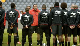 Belgium&#x27;s national soccer team coach Marc Wilmots, center, talks to his players during a training session at Friends Arena in Stockholm, Sweden, Saturday May 31, 2013. The Belgian team, heading for the World Cup, will play a friendly with Sweden Sunday, June 1. (AP photo/Janerik Henriksson, TT news Agency)    SWEDEN OUT