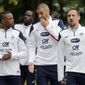 France&#39;s Patrice Evra, left,  Karim Benzema, center, and Franck Ribery arrive for a training session at the Clairefontaine training center, outside Paris, Thursday, May 29, 2014. France are preparing for the upcoming soccer World Cup in Brazil starting on 12 June. (AP Photo/Christophe Ena)