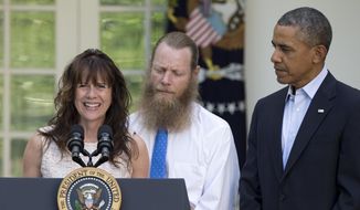 Accompanied by President Barack Obama, Jani Bergdahl, and Bob Bergdahl speak during a news conference in the Rose Garden of the White House in Washington on Saturday, May 31, 2014 about the release of their son, U.S. Army Sgt. Bowe Bergdahl. Bergdahl, 28, had been held prisoner by the Taliban since June 30, 2009. He was handed over to U.S. special forces by the Taliban in exchange for the release of five Afghan detainees held by the United States. (AP Photo/Carolyn Kaster)