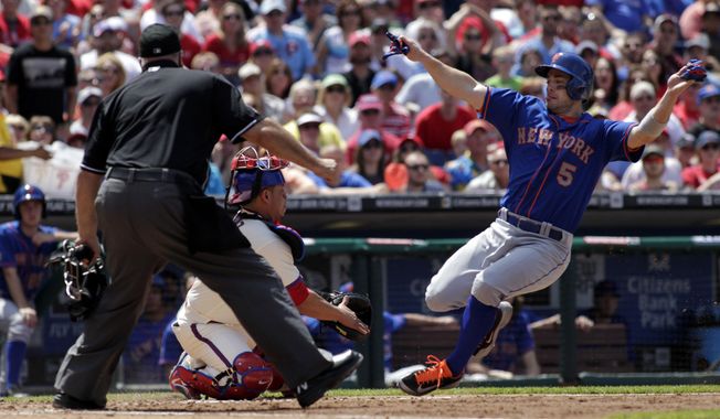 New York Mets&#x27; David Wright (5) scores as Philadelphia Phillies&#x27; Carlos Ruiz moves for a late tag in the fourth inning of a baseball game, Sunday, June 1, 2014, in Philadelphia. Home plate umpire Brian O&#x27;Nora. (AP Photo/H. Rumph Jr)