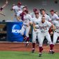 Players from the Standford bench erupt in cheers as Stanford University&#39;s Wayne Taylor (7) rounds the bases after hitting a three-run homer during an NCAA college baseball regional tournament game in Bloomington, Ind., Sunday, June 1, 2014. Stanford defeated Indiana 10-7. (AP Photo/Doug McSchooler)
