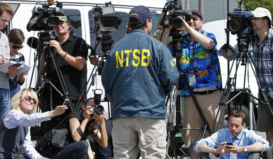 National Transportation Safety Board senior air safety investigator Luke Schiada speaks during a news conference at Hanscom Field in Bedford, Mass., Sunday, June 1, 2014. The co-owner of the Philadelphia Inquirer newspaper, Lewis Katz, was killed along with six other people in a fiery plane crash in Massachusetts, just days after reaching a deal that many hoped would end months of infighting at the newspaper and help restore it to its former glory. (AP Photo/Michael Dwyer)