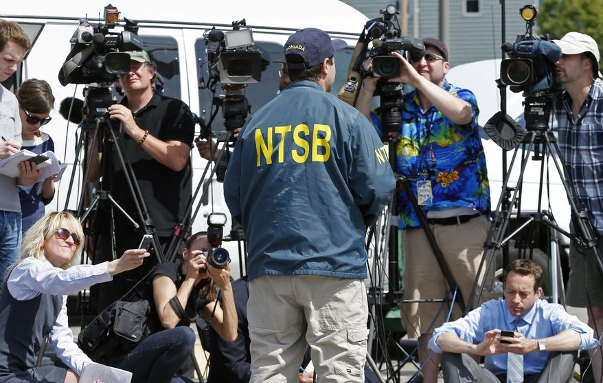 National Transportation Safety Board senior air safety investigator Luke Schiada speaks during a news conference at Hanscom Field in Bedford, Mass., Sunday, June 1, 2014. The co-owner of the Philadelphia Inquirer newspaper, Lewis Katz, was killed along with six other people in a fiery plane crash in Massachusetts, just days after reaching a deal that many hoped would end months of infighting at the newspaper and help restore it to its former glory. (AP Photo/Michael Dwyer)