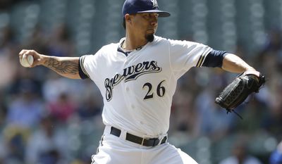 Milwaukee Brewer starting pitcher Kyle Lohse throws to the Chicago Cubs during the first inning of a baseball game on Sunday, June 1, 2014, in Milwaukee. (AP Photo/Jeffrey Phelps)