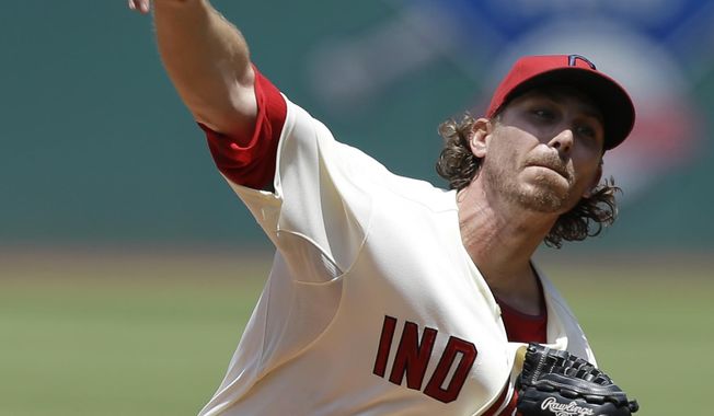 Cleveland Indians starting pitcher Josh Tomlin delivers in the first inning of a baseball game against the Colorado Rockies, Sunday, June 1, 2014, in Cleveland. (AP Photo/Tony Dejak)
