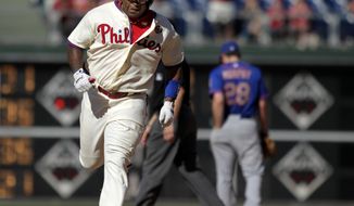 Philadelphia Phillies&#39;  Marlon Byrd  runs the bases after hitting a solo home run against the New York Mets in the eleventh inning of a baseball game on Sunday, June 1, 2014, in Philadelphia. The Mets won 4-3.  (AP Photo/H. Rumph Jr.)