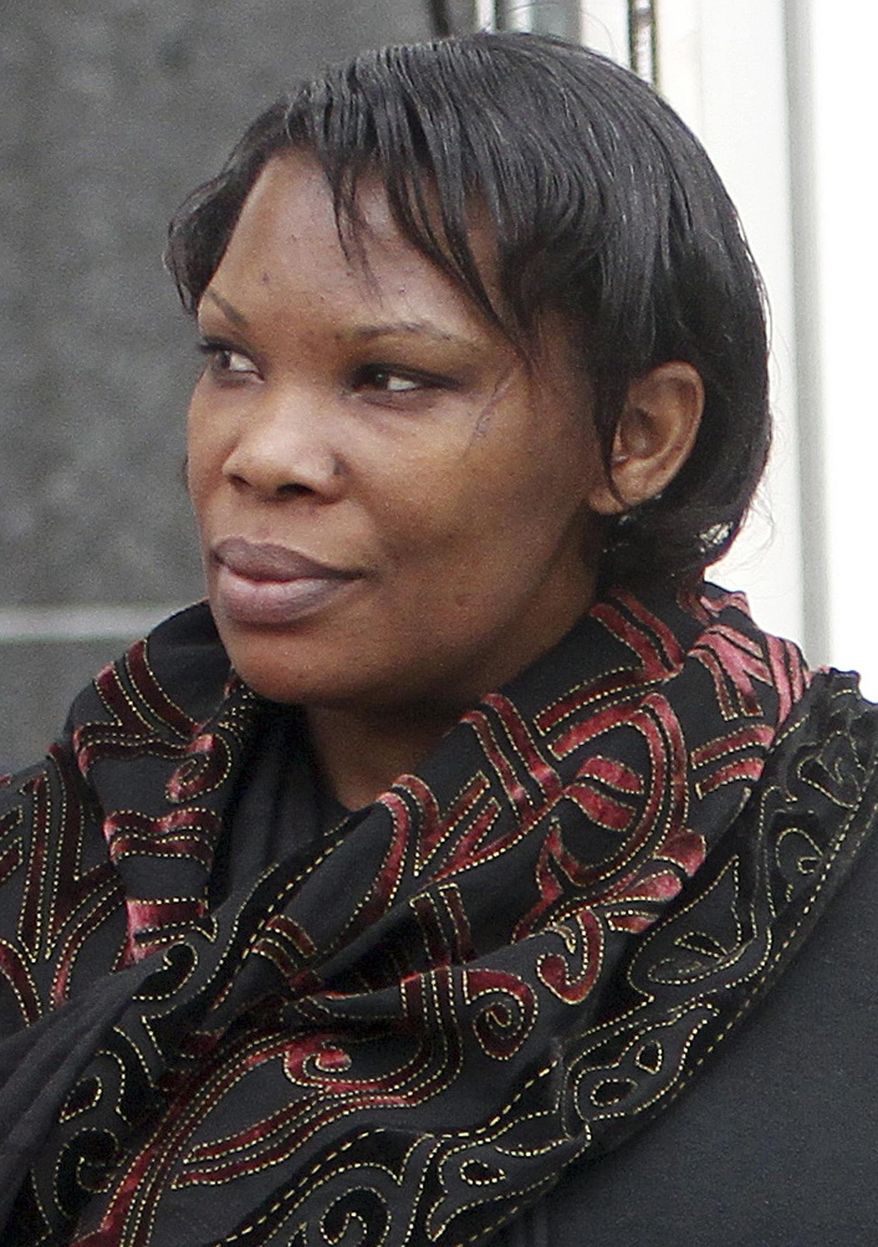 FILE- In this Thursday April 12, 2012 file photo, Beatrice Munyenyezi leaves federal court in Concord, N.H. Munyenyezi is serving a 10-year prison sentence after being convicted of lying about her role in the 1994 Rwanda genocide to come to the U.S. and eventually obtain citizenship. Her attorney, David Ruoff, is seeking to have her conviction overturned. Ruoff said in a brief filed May 14, 2014, in the 1st Circuit Court of Appeals in Boston, that the trial judge should have granted a mistrial after Assistant U.S. Attorney John Capin made false assertions while cross-examining a defense witness. (AP Photo/Jim Cole, File)
