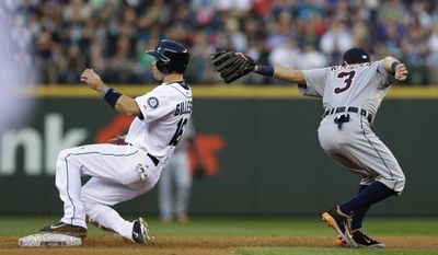 Seattle Mariners' Cole Gillespie, left, reaches second base past Detroit Tigers second baseman Ian Kinsler on a single by Willie Bloomquist in the second inning of a baseball game, Saturday, May 31, 2014, in Seattle. (AP Photo/Ted S. Warren)