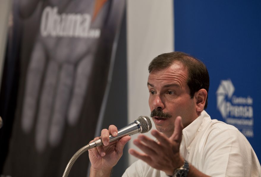 Cuban intelligence agent Fernando Gonzalez, known as one of the "Cuban Five," speaks during a press conference in Havana, Cuba, Monday, June 2, 2014. Gonzalez who spent years in jail in the United States says the exchange of five Taliban detainees for a U.S. Army sergeant held captive in Afghanistan could set a precedent for a similar swap with Cuba. Gonzalez said Monday that the only thing needed is political will by the Obama administration to negotiate a swap of U.S. government subcontractor Alan Gross for three Cuban agents still imprisoned in the United States. (AP Photo/Franklin Reyes)