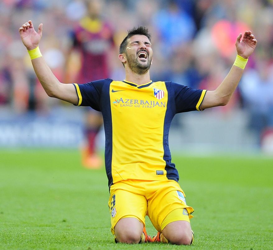FILE - In this May 17, 2014 file photo, Atletico's David Villa celebrates at the end of a Spanish La Liga soccer match between FC Barcelona and Atletico Madrid at the Camp Nou stadium in Barcelona, Spain. Villa has signed a three-year contract with New York City FC, becoming the first player on the expansion Major League Soccer team that starts play next season. (AP Photo/Manu Fernandez, File)