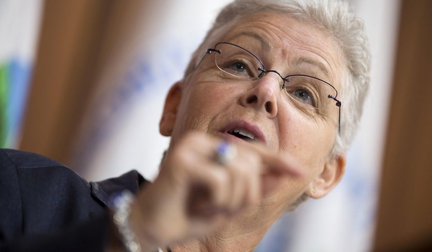 Environmental Protection Agency (EPA) Administrator Gina McCarthy gestures during an announcement of a plan to cut carbon dioxide emissions from power plants by 30 percent by 2030, Monday, June 2, 2014, at EPA headquarters in Washington. In a sweeping initiative to curb pollutants blamed for global warming, the Obama administration unveiled a plan Monday that cuts carbon dioxide emissions from power plants by nearly a third over the next 15 years, but pushes the deadline for some states to comply until long after President Barack Obama leaves office. (AP Photo/ Evan Vucci)