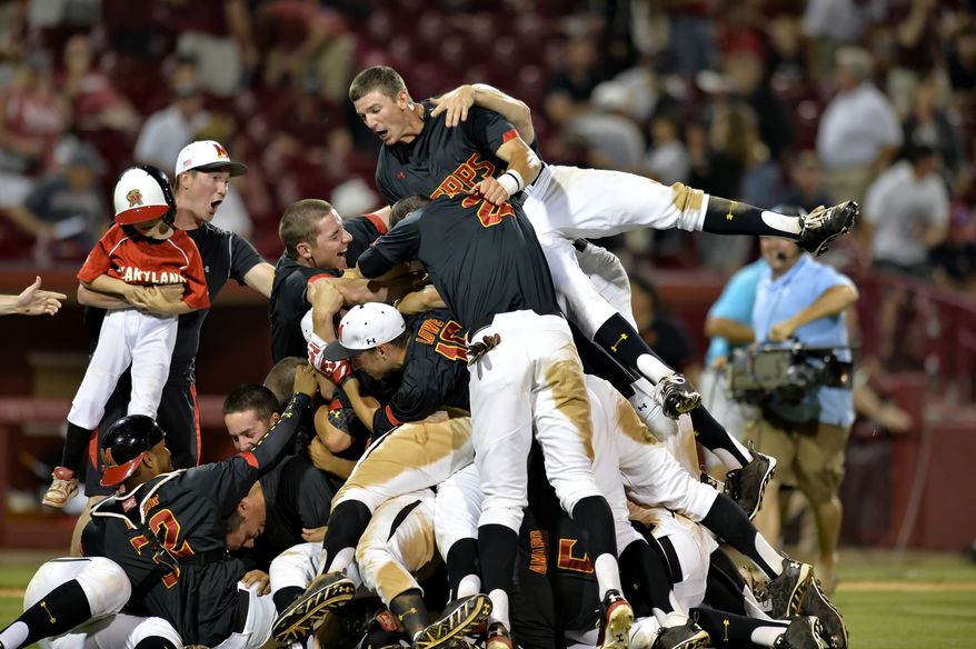 The Maryland Terrapins celebrate during an NCAA college baseball regional tournament game against South Carolina in Columbia, S.C., Sunday, June 1, 2014. Maryland won 10-1. (AP Photo/ Richard Shiro)