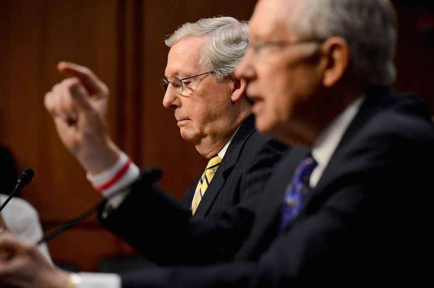 Senate Majority Leader Harry Reid (right) proposes a constitutional amendment to eliminate campaign spending. Senate Minority Leader Mitch McConnell disagrees. (Andrew Harnik/The Washington Times)