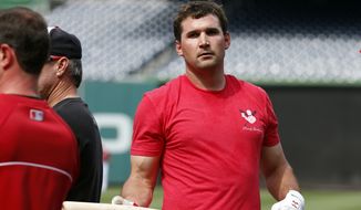 Washington Nationals third baseman Ryan Zimmerman holds a bat during batting practice before a baseball game against the Miami Marlins at Nationals Park Wednesday, May 28, 2014, in Washington. Zimmerman is on the disabled list with a broken thumb, and was recently cleared to swing a bat. (AP Photo/Alex Brandon)
