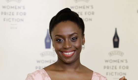 Chimamanda Ngozi Adichie – Americanah, one of the authors shortlisted for the Bailey&#39;s Women&#39;s Prize for Fiction during a photocall ahead of the awards ceremony at the Royal Festival Hall in London, Wednesday, June 4, 2014. The Baileys Women’s Prize for Fiction is the UK’s only annual book award for fiction written by a woman. (AP Photo/Kirsty Wigglesworth)