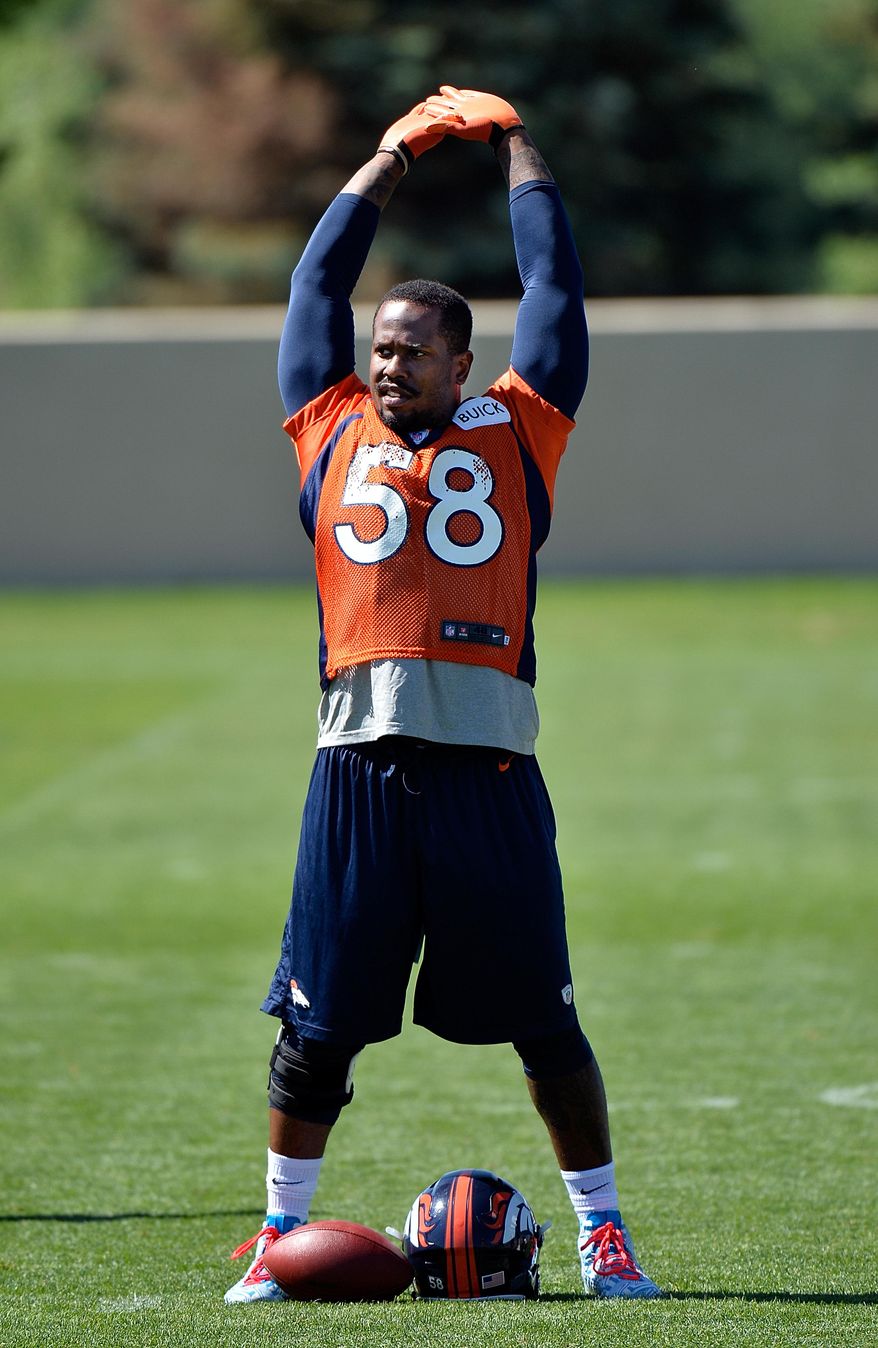 Denver Broncos' Von Miller stretches during an NFL football organized team activity, Monday, June 2, 2014, in Englewood, Colo. (AP Photo/Jack Dempsey)