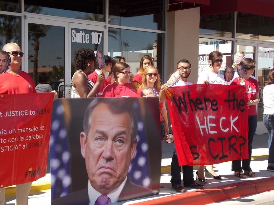 This image provided by the Progressive Leadership Alliance of Nevada, shows demonstrators at Republican Rep. Joe Heck’s office in Las Vegas, Wednesday, June 4, 2014. Organizers say about 50 people participated in the rally, which coincided with 26 other protests around the country urging lawmakers to pass comprehensive immigration reform. Five demonstrators were cited by police after refusing to leave Heck’s office. (AP Photo/ Progressive Leadership Alliance of Nevada, Astrid Silva)