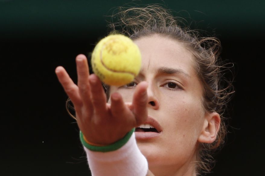 Germany's Andrea Petkovic serves the ball during the quarterfinal match of the French Open tennis tournament against Italy's Sara Errani at the Roland Garros stadium, in Paris, France, Wednesday, June 4, 2014. (AP Photo/Darko Vojinovic)