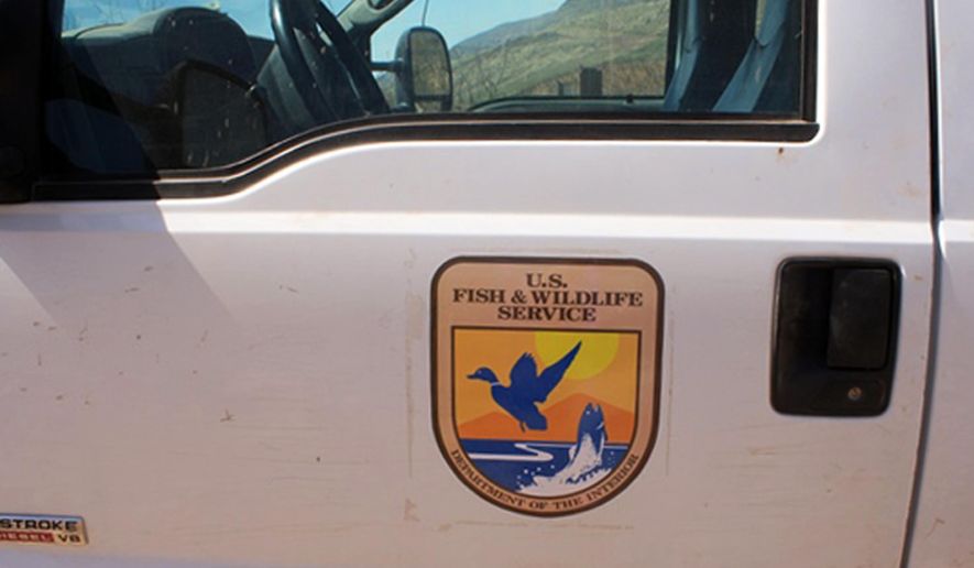 This Monday, June 2, 2014 photo provided by U.S. Customs and Border Protection shows detail of a decal on a truck made to look as if it belonged to the U.S. Fish and Wildlife Service, but which was actually carrying more than 3,200 pounds of marijuana, east of Douglas, Ariz. Agents found the truck with the federal agency's decals along the border with Mexico. The driver and a passenger fled from the truck into Mexico after being pulled over by border agents. Agents then discovered that the truck, which had fake decals, was filled with $1.6 million worth of marijuana. (AP Photo/U.S. Customs and Border Patrol)
