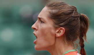 Germany&#39;s Andrea Petkovic celebrates winning the first set of the quarterfinal match of the French Open tennis tournament against Italy&#39;s Sara Errani at the Roland Garros stadium, in Paris, France, Wednesday, June 4, 2014.  (AP Photo/Darko Vojinovic)