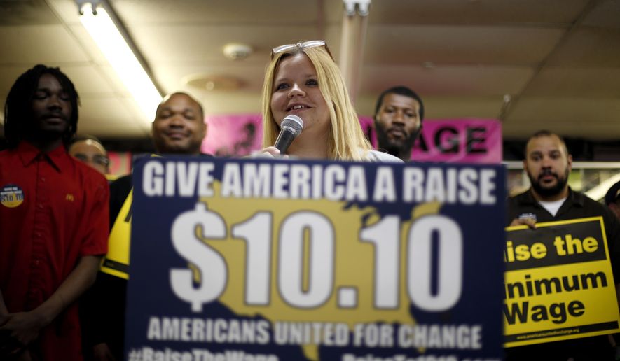 In this photo made Friday, April 25, 2014, Amy Jennewein speaks during a rally in support of raising the minimum wage University City, Mo. Jennewein, who lives in the outer St. Louis suburb of House Springs, earns a little above Missouri’s $7.50 minimum wage at one of her jobs and nearly $11 an hour at the other. (AP Photo/Jeff Roberson)