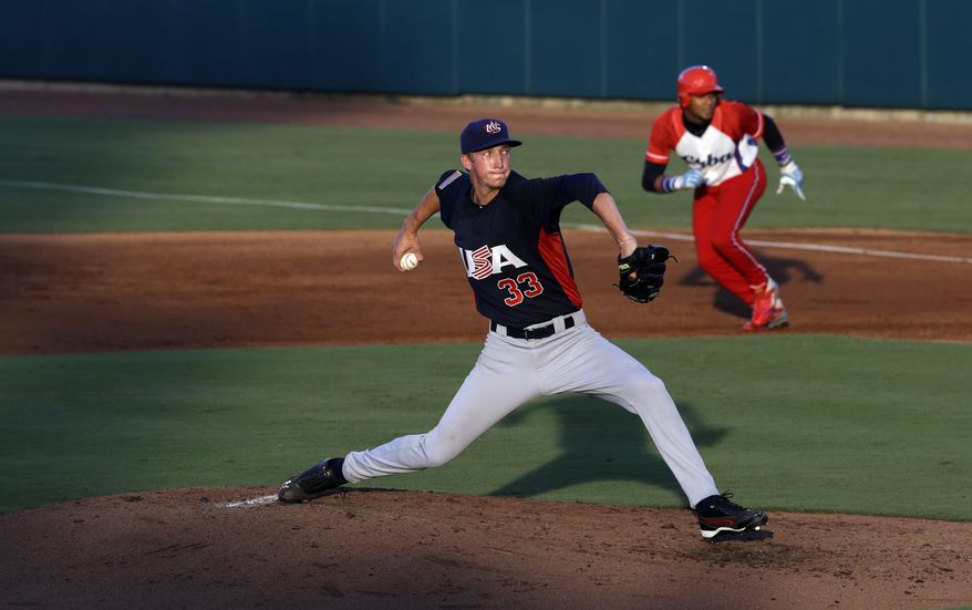 United States pitcher Erick Fedde (33) winds up during the second inning of an exhibition baseball game against Cuba in Cary, N.C., Monday, July 22, 2013. (AP Photo/Gerry Broome)