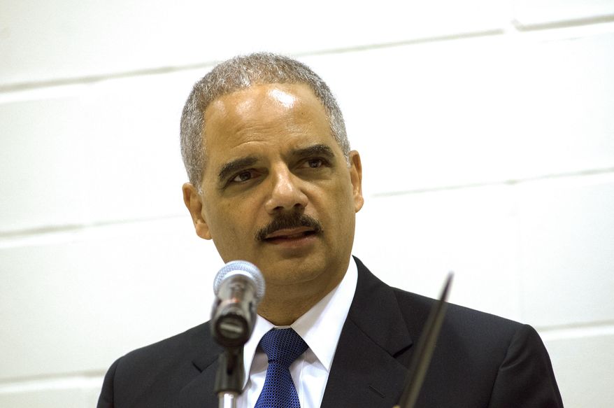 U.S. Attorney General Eric Holder delivers his keynote address at a tribal conference on the campus of United Tribes Technical College in Bismarck, N.D., on Thursday, June 5, 2014. Holder says the Justice Department and the Obama administration have "fought to protect natural resources and water rights on tribal lands ... and prioritized the resolution of longstanding legal disputes." He says the administration also has helped tribal authorities "combat violence against Native women." (AP Photo/Kevin Cederstrom)