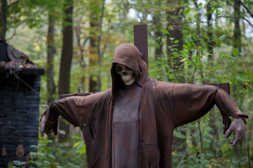 Scary decorations line the forest at Creepy Woods Haunted Woods, in Kingsville, MD., Wednesday, October 16, 2013. (Andrew S Geraci/The Washington Times)