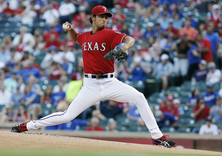 Texas Rangers starting pitcher Yu Darvish throws during the first inning of a baseball game against the Cleveland Indians, Friday, June 6, 2014, in Arlington, Texas. (AP Photo/Brandon Wade)