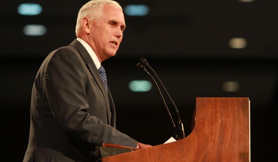Gov. Mike Pence speaks during the Republican Party State Convention at the Grand Wayne Center, Fort Wayne, Ind., Saturday, June 7, 2014. Indiana Republicans picked an all-woman team to lead their ticket in November at their convention Saturday, but also struggled through a divisive gay marriage battle and heard their state treasurer compare national economy to the events leading up to Germany's 1936 elections under the Nazi regime. (AP Photo/The Journal-Gazette, Rachel Von)