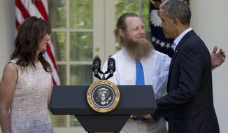 FILE - In this Saturday, May 31, 2014 file photo, President Barack Obama shakes hands with Bob Bergdahl as Jani Bergdahl stands at left, during a news conference in the Rose Garden of the White House in Washington about the release of their son, U.S. Army Sgt. Bowe Bergdahl. The soldier went missing from his outpost in Afghanistan in June 2009 and was released from Taliban captivity on May 31, 2014 in exchange for five enemy combatants held in the U.S. prison in Guantanamo Bay, Cuba. (AP Photo/Carolyn Kaster)