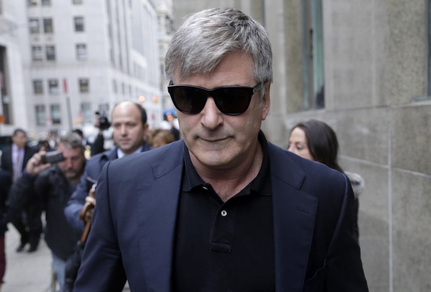 ** FILE ** In this Nov. 12, 2013, file photo, actor Alec Baldwin leaves court in New York. (AP Photo/Seth Wenig, File)