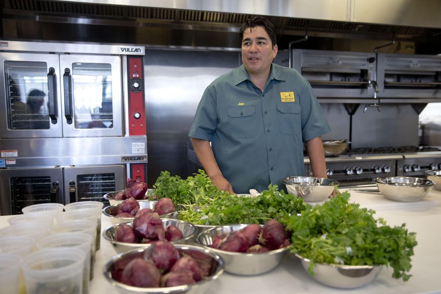 In this file photo, Chef Jose Garces gives speaks at the Free Library of Philadelphia's Culinary Literacy Center, Monday, June 2, 2014, in Philadelphia. On May 2, 2018, Mr. Garces filed for Chapter 11 bankruptcy protection. (AP Photo/Matt Rourke) **FILE**