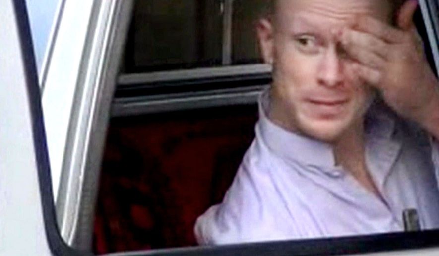 In this file image taken from video obtained from Voice Of Jihad Website, which has been authenticated based on its contents and other AP reporting, Sgt. Bowe Bergdahl, sits in a vehicle guarded by the Taliban in eastern Afghanistan. Bergdahl was freed by the Taliban on May 31, 2014, in exchange for five Afghan detainees held in the U.S. prison at Guantanamo Bay, Cuba. (AP Photo/Voice Of Jihad Website via AP video, File)