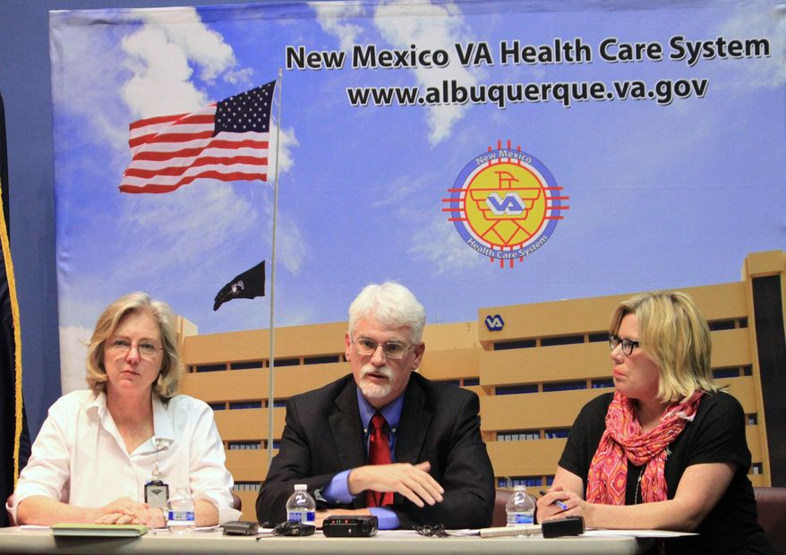 New Mexico Veterans Affairs health care system interim director James Robbins, center, talks about patient wait times, while Dr. Meghan Gerety, left, and associate director Pamela Crowell listen during a news conference in Albuquerque, N.M., on Tuesday, June 10, 2014. VA officials acknowledged that a recent audit highlights problems with wait times for veterans in New Mexico. (AP Photo/Susan Montoya Bryan)
