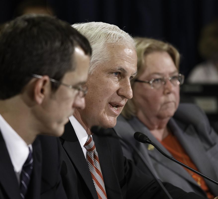 Richard J. Griffin, center, acting inspector general for the Department of Veterans Affairs, testifies as the House Committee on Veterans' Affairs holds a hearing to examine why thousands of military veterans have been waiting for up to three months for medical appointments, on Capitol Hill in Washington, Monday, June 9, 2014. He is flanked by Philip Matkovsky, left, assistant deputy under secretary for health for administrative operations at the Department of Veterans Affairs, and Linda A. Halliday, assistant inspector general for audits and evaluations at the Department of Veterans Affairs. (AP Photo/J. Scott Applewhite)
