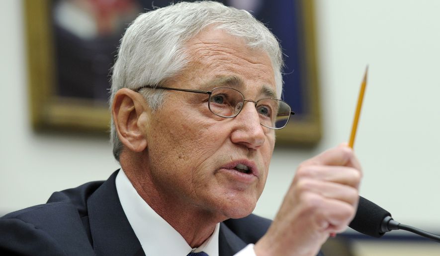Defense Secretary Chuck Hagel testifies on Capitol Hill in Washington, Wednesday, June 11, 2014, before the House Armed Services Committee. Hagel faced angry lawmakers becoming the first Obama administration official to testify publicly about the controversial prisoner swap with the Taliban. (AP Photo/Susan Walsh)