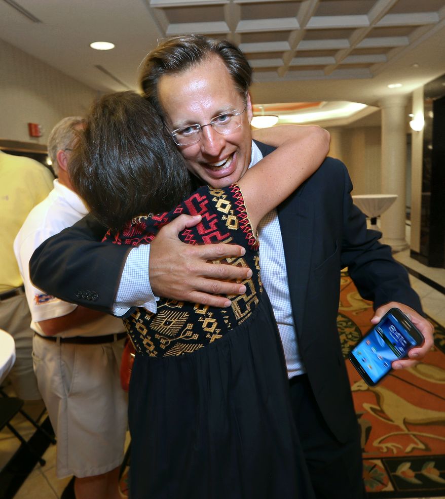 Dave Brat is congratulated by a supporter after defeating Republican Congressman Eric Cantor in the Republican primary for the 7th Congressional District in Virginia on Tuesday, June 10, 2014 in Henrico, Va. Less than 24 hours after Majority Leader Eric Cantor's stunning primary defeat, House Republicans are jockeying for leadership positions. Officials say Rep. Kevin McCarthy of California is telling fellow Republicans he plans to run to succeed Cantor, and Rep. Pete Sessions of Texas is also signaling he's interested. (AP Photo/Richmond Times-Dispatch, P. Kevin Morley)