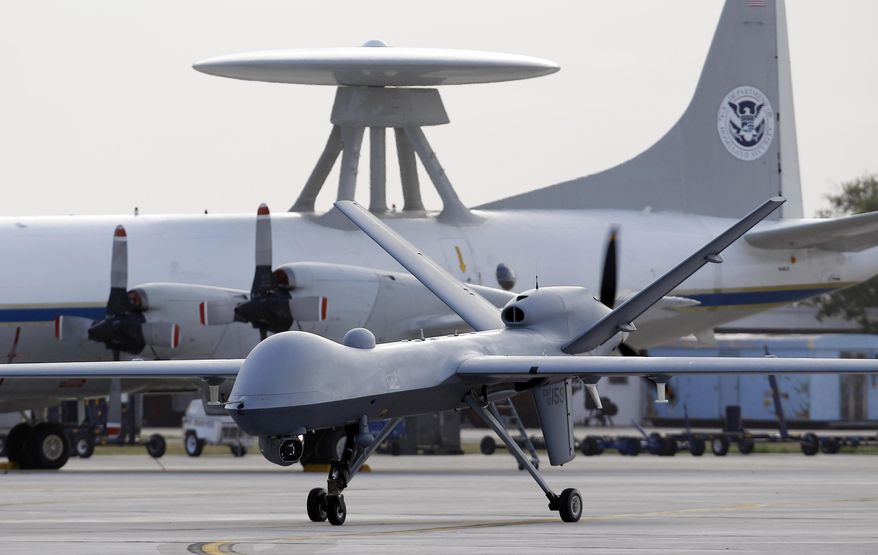 *FILE** A Predator B unmanned aircraft taxis at the Naval Air Station in Corpus Christi, Texas, on Nov. 8, 2011. (Associated Press)