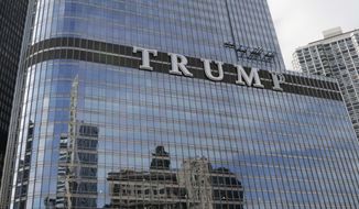 Newly installed 20-foot-tall letters spelling out T-R-U-M-P stand on the side real estate billionaire Donald trump&#39;s skyscraper in Chicago, Thursday, June 12, 2014. The letters have triggered a war of words between Trump and Chicago Mayor Rahm Emanuel.&amp;#160;(AP Photo/Stacy Thacker)